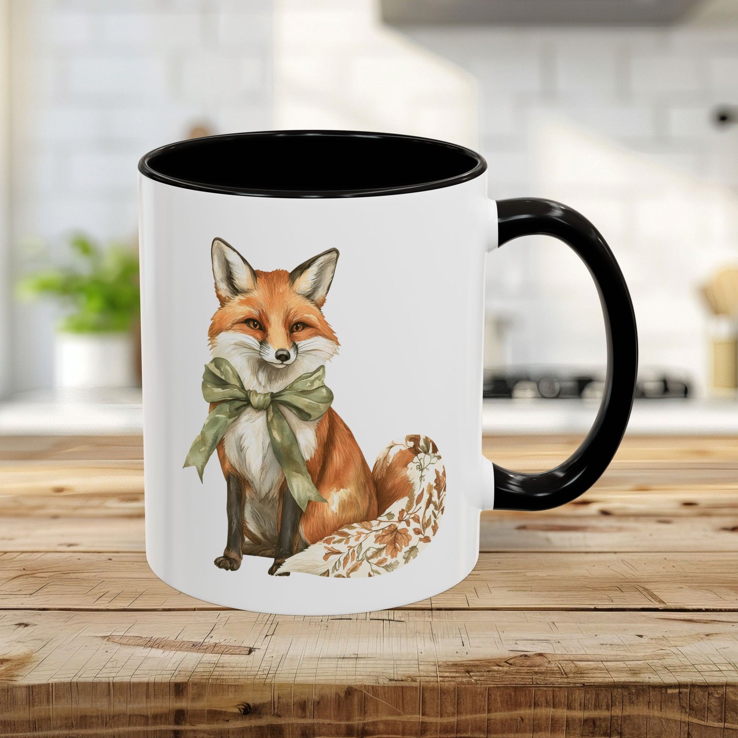 11oz white ceramic mug with a watercolor fox wearing a green bow, black handle and interior.