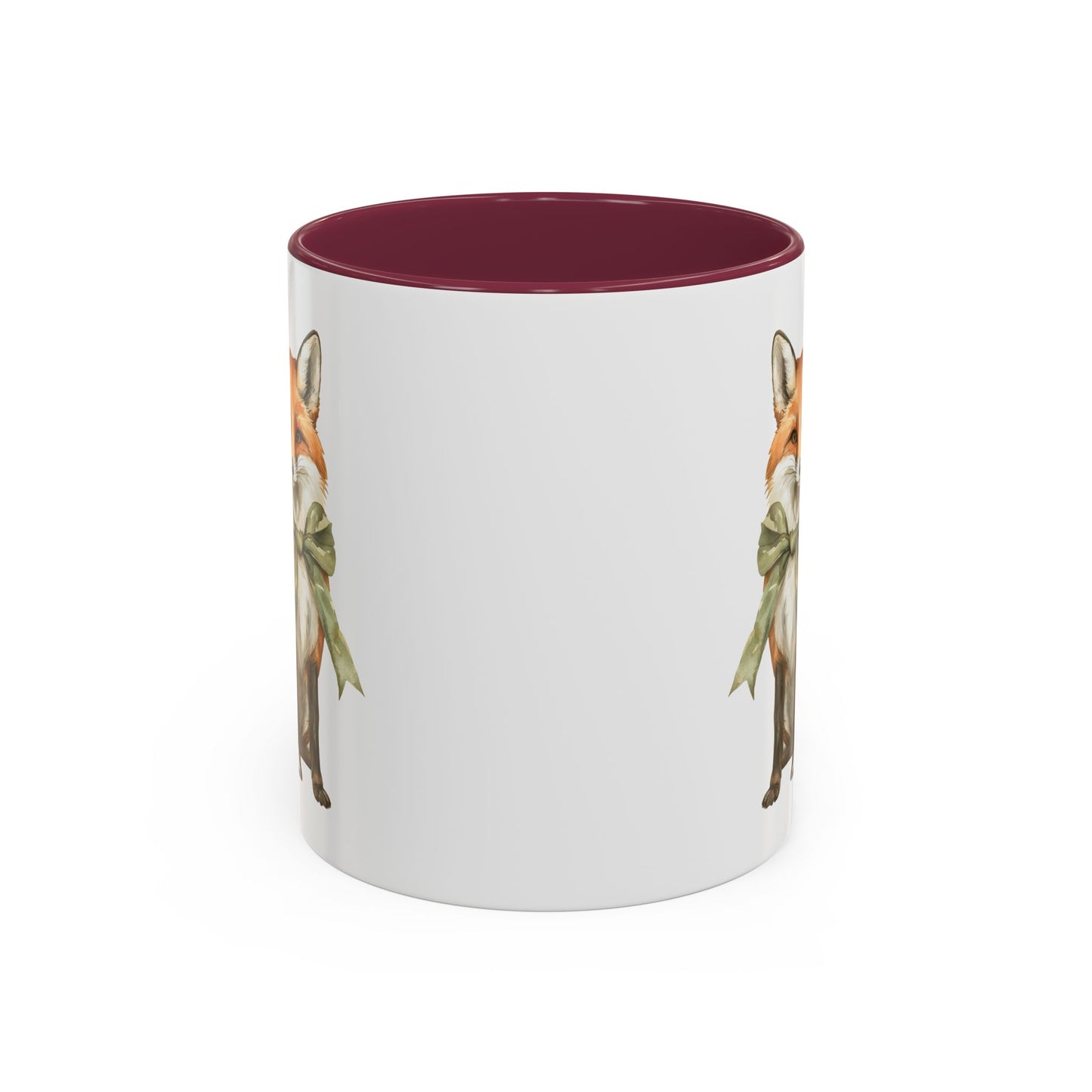 White ceramic mug with a watercolor fox wearing a green bow, featuring a burgundy interior and handle.