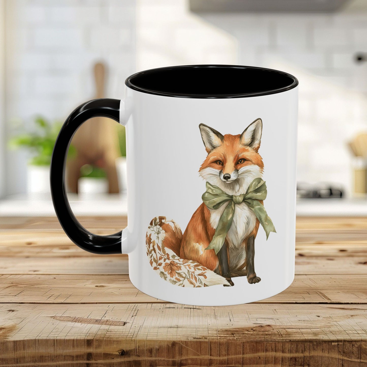 Boho autumn fox ceramic mug with a green bow, black handle, and interior, on a wooden table.