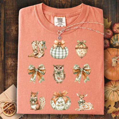 Terracotta cotton t-shirt with boho fall artwork: bows, pumpkins, acorn, owl, squirrel, and deer.