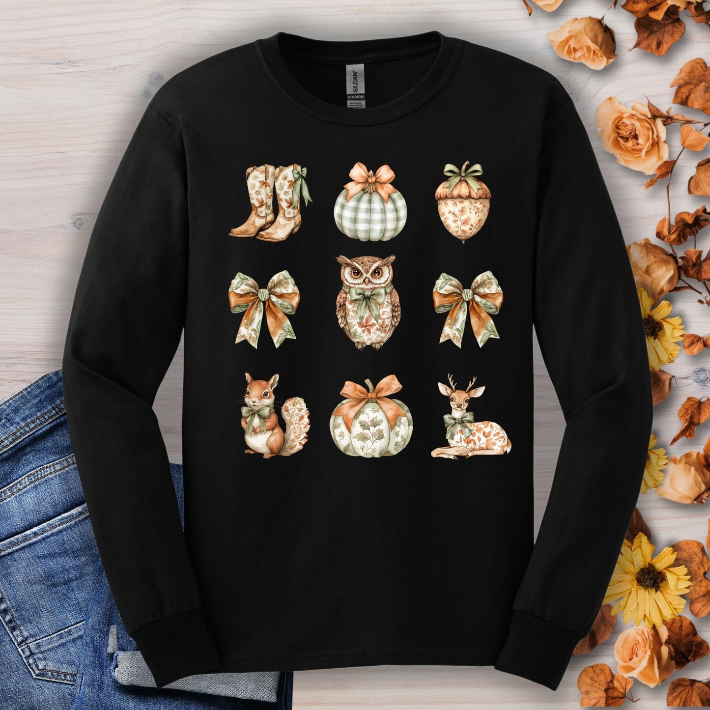 Black long sleeve tee with boho fall designs: owl, squirrel, deer, pumpkins, boots, acorns, and bows.
