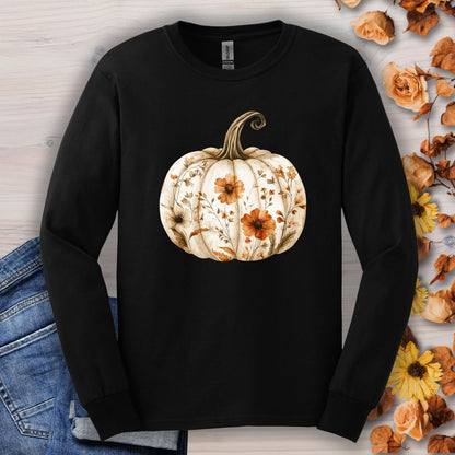 Black Gildan 2400 long sleeve tee with a white boho floral pumpkin design, surrounded by fall leaves.