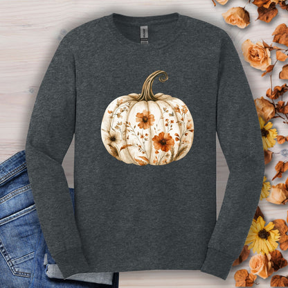 Dark Heather long sleeve tee with a white boho floral pumpkin design, surrounded by autumn leaves.