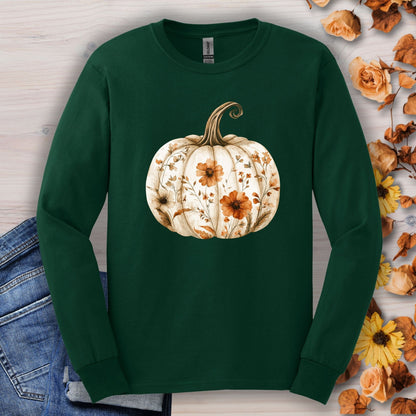 Forest Green long sleeve tee with a white boho floral pumpkin design, surrounded by autumn leaves.