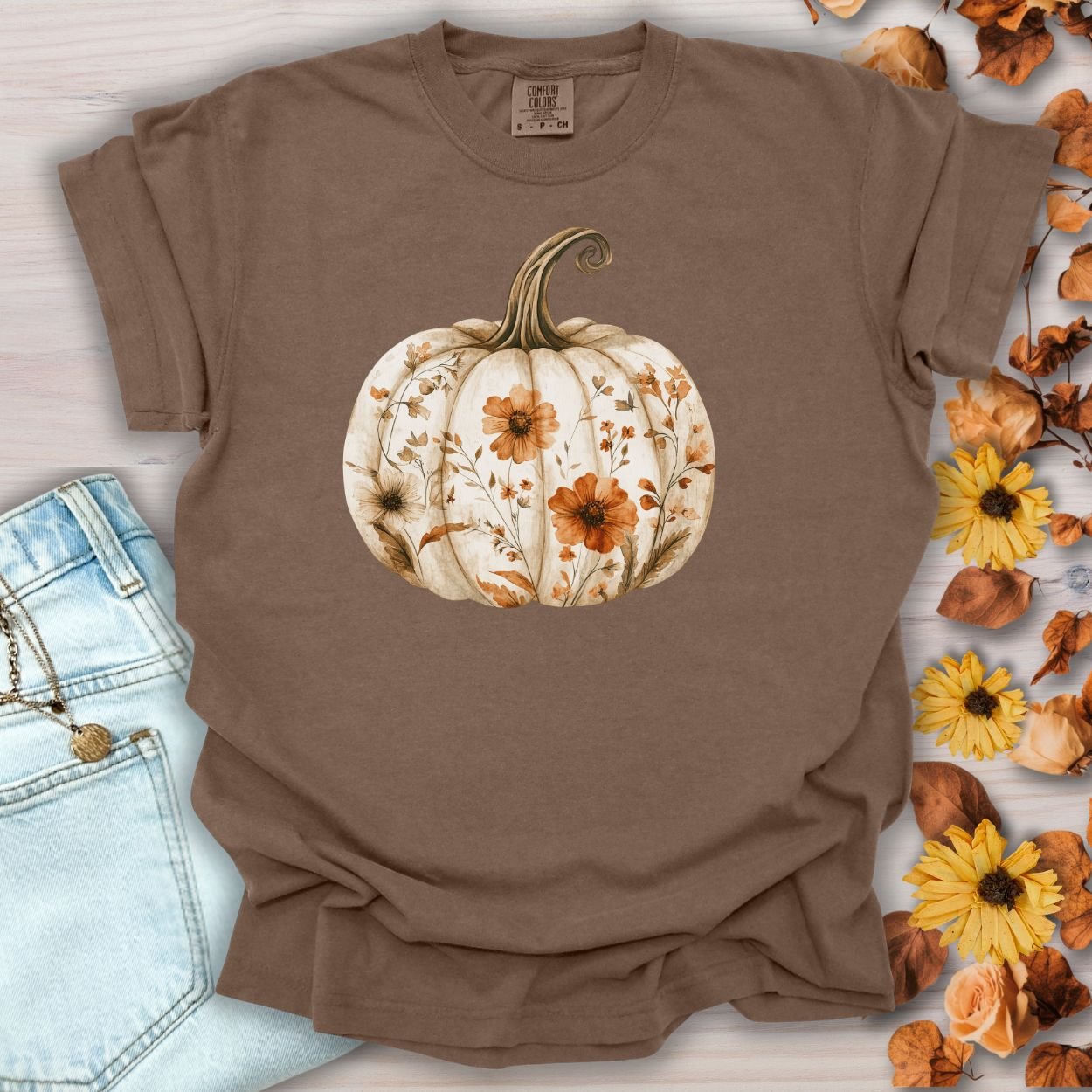 Espresso garment-dyed t-shirt with a white pumpkin blooming with delicate wildflowers.