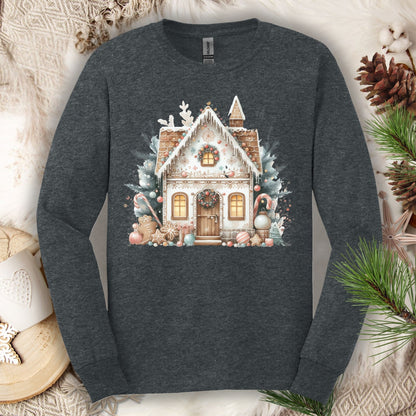 Dark Heather long sleeve tee with a watercolor boho gingerbread house in muted tan, blush, and blue.