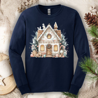 Navy long sleeve tee with a watercolor boho gingerbread house in muted tan, blush, and powder blue.
