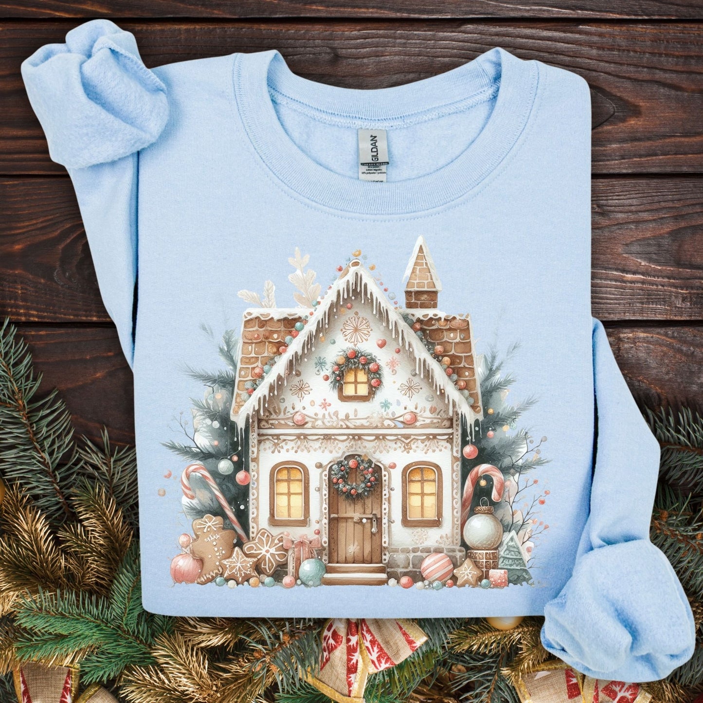 Light blue Gildan crewneck sweatshirt with a watercolor boho gingerbread house design.