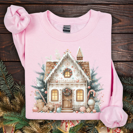 Light pink Gildan cotton-poly blend sweatshirt with a watercolor boho gingerbread house design.