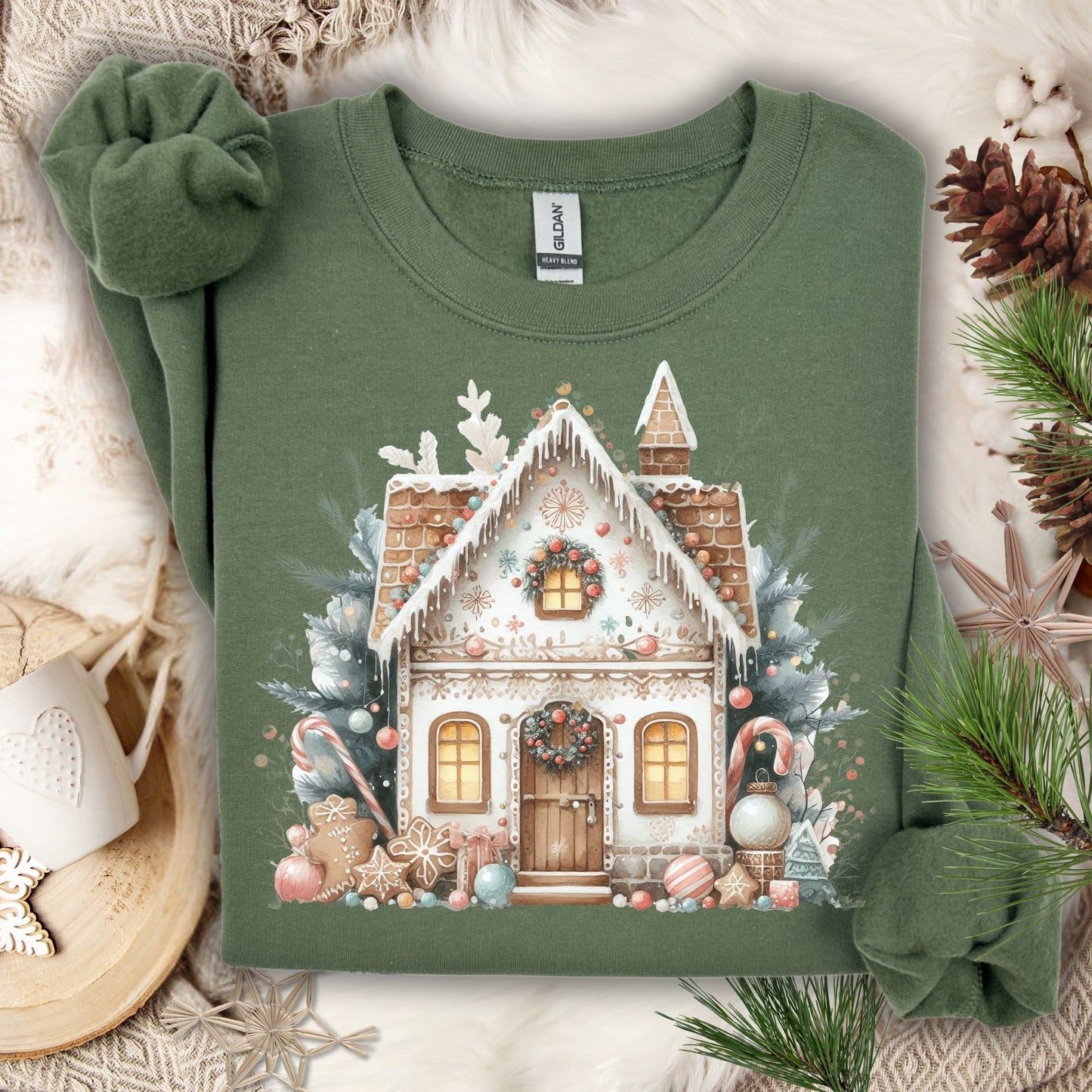 Military Green Gildan crewneck sweatshirt with a watercolor boho gingerbread house design.