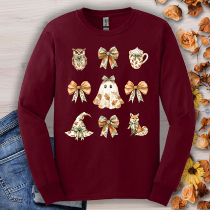 Maroon long-sleeve cotton tee with a cottagecore Halloween design: ghost, witch hat, fox, owl, and bows.