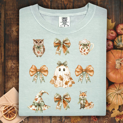Bay-colored Comfort Colors t-shirt with boho Halloween favorites: owl, bows, latte, ghost, witch hat, and fox.