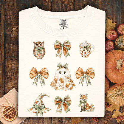 Ivory cotton t-shirt with boho Halloween cottage artwork: owl, bows, ghost, witch hat, latte, and fox.