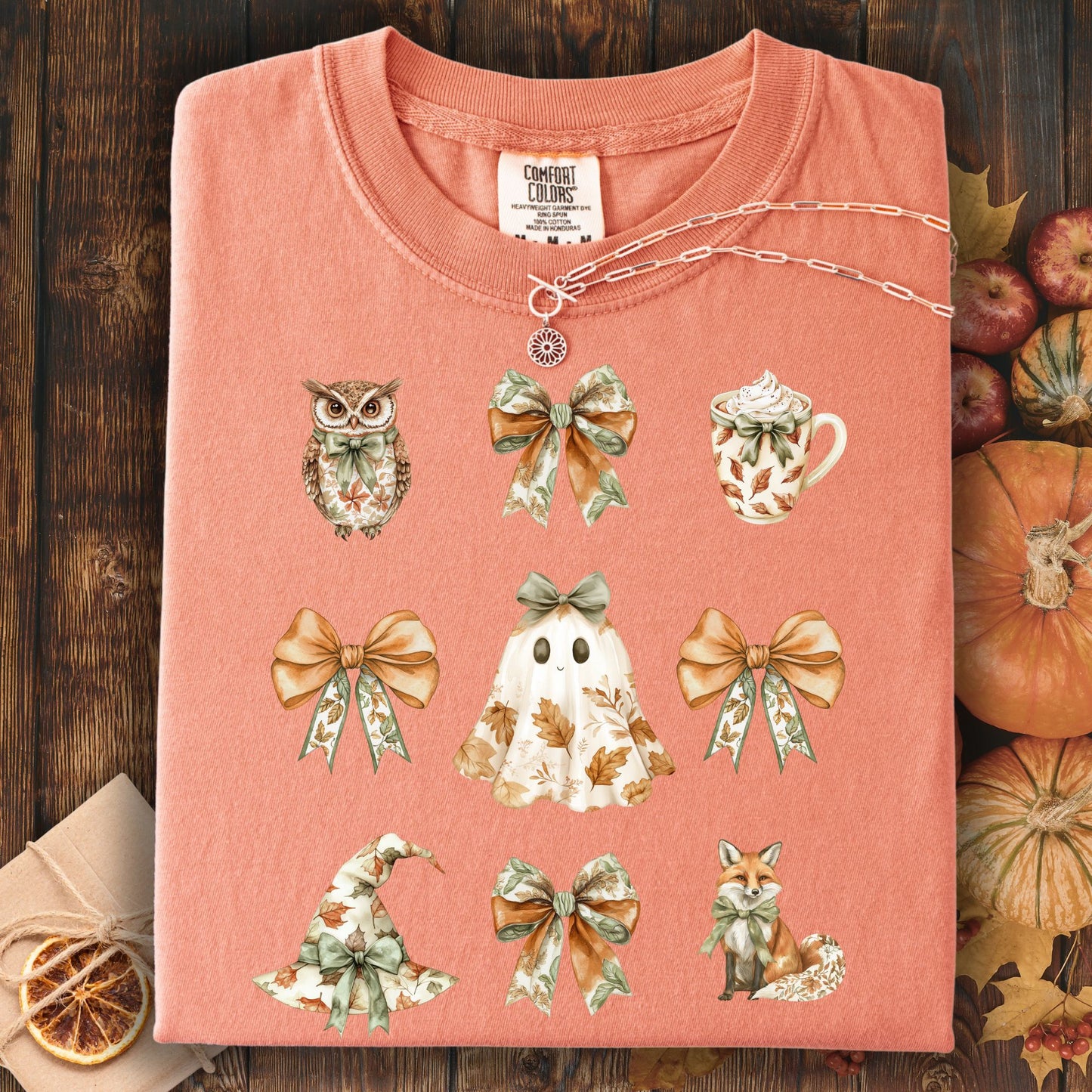 Terracotta heavyweight cotton t-shirt with boho Halloween favorites: owl, ghost, witch hat, fox, latte, and bows.