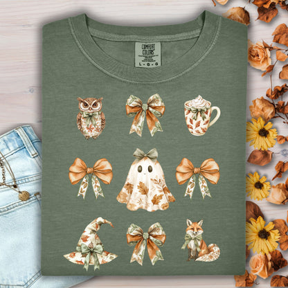 Moss green cotton t-shirt with boho Halloween art: owl, bows, latte, ghost, witch hat, and fox.