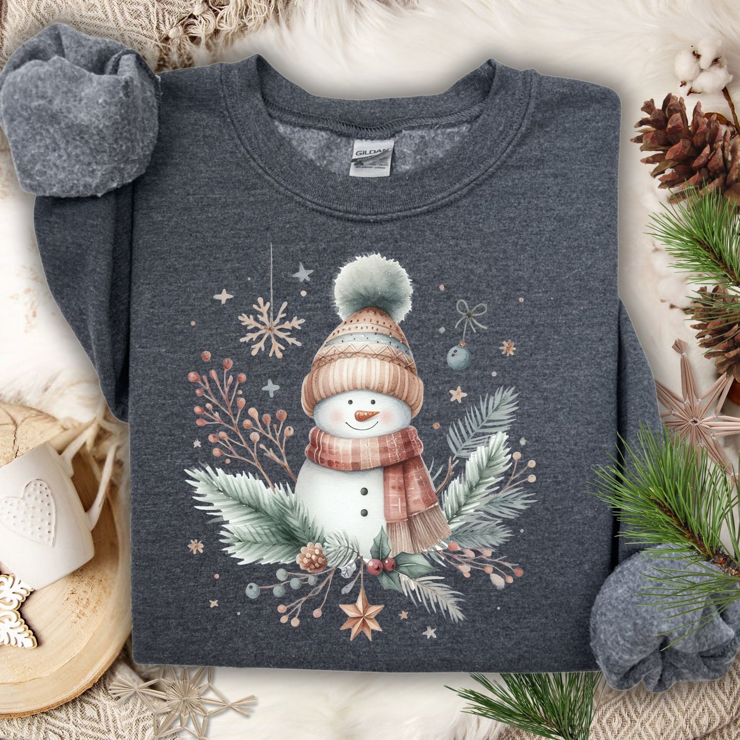 Dark Heather S crewneck sweatshirt with a boho watercolor snowman, evergreen sprigs, and ornaments.