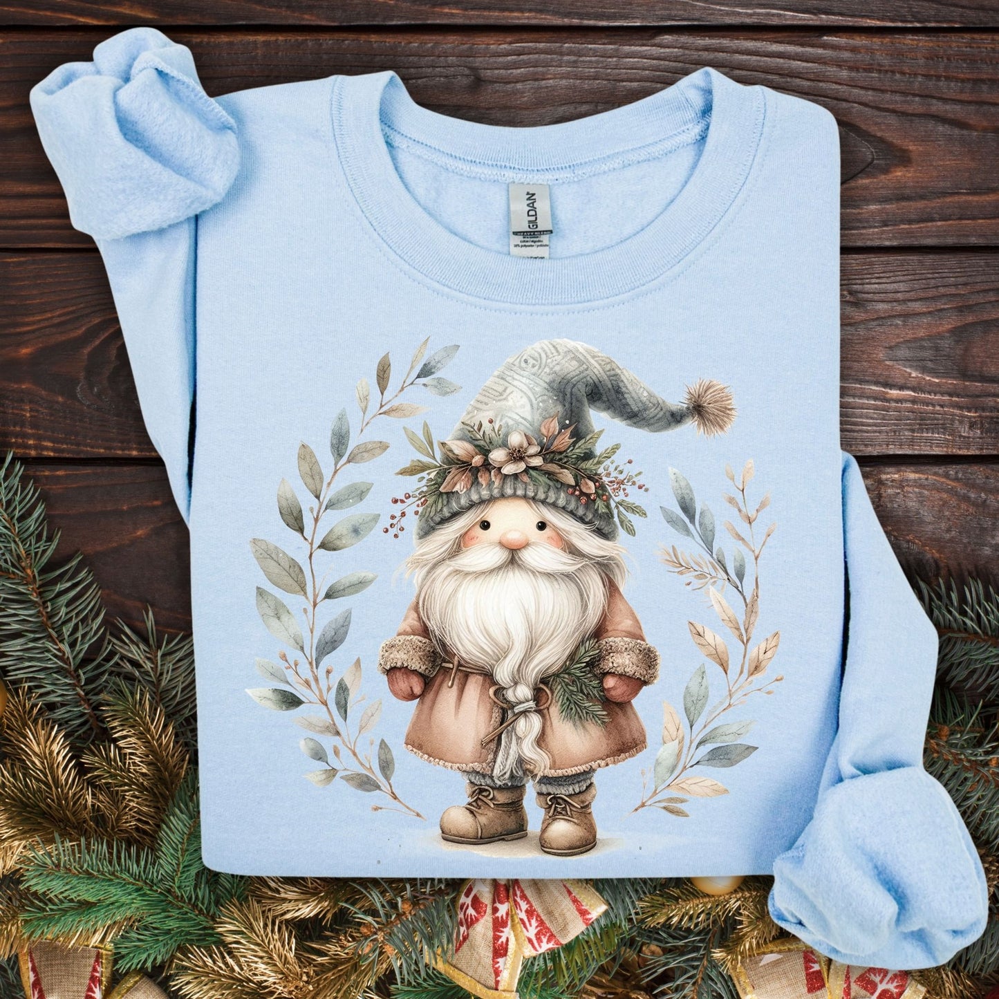 Light blue Gildan sweatshirt with a boho Nordic St. Nick and watercolor winter foliage design.