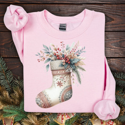 Light pink Gildan sweatshirt with a watercolor boho stocking filled with evergreen and berries.