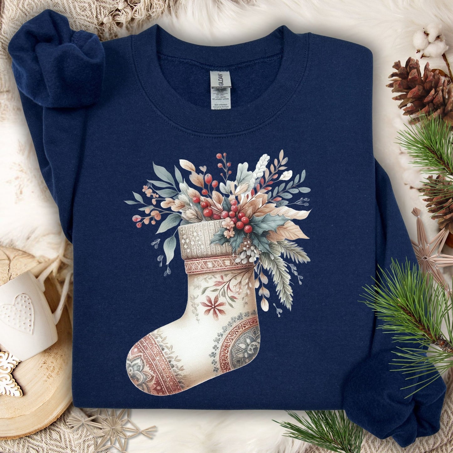 Navy Gildan sweatshirt with a watercolor boho stocking design overflowing with greenery and berries.