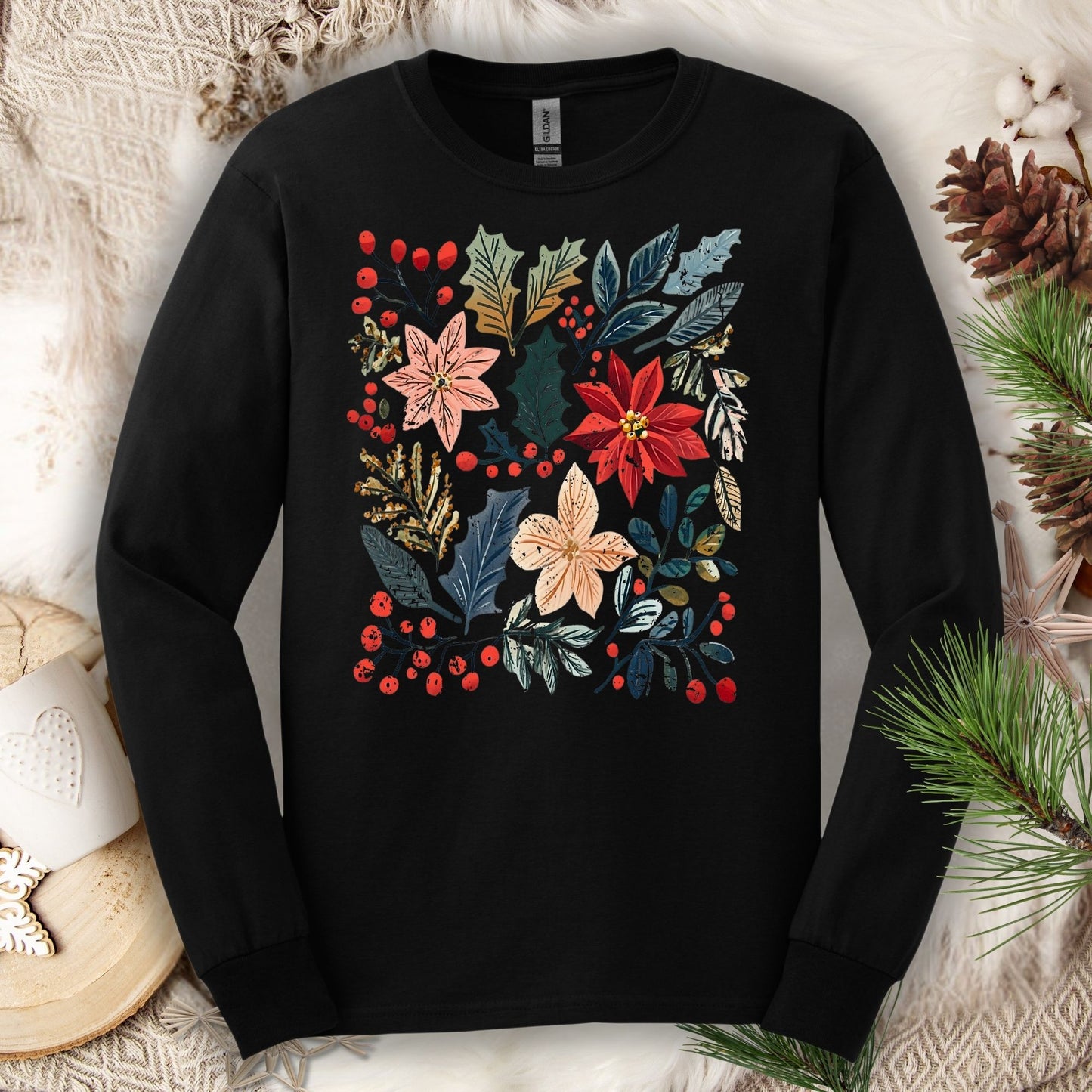Black Gildan long sleeve tee with a vibrant boho watercolor poinsettia and floral design.