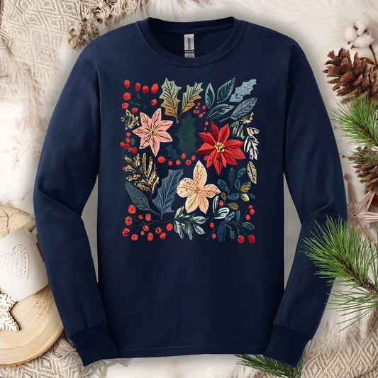 Navy long sleeve tee with a vibrant boho watercolor poinsettia and floral design, surrounded by rustic holiday decor.