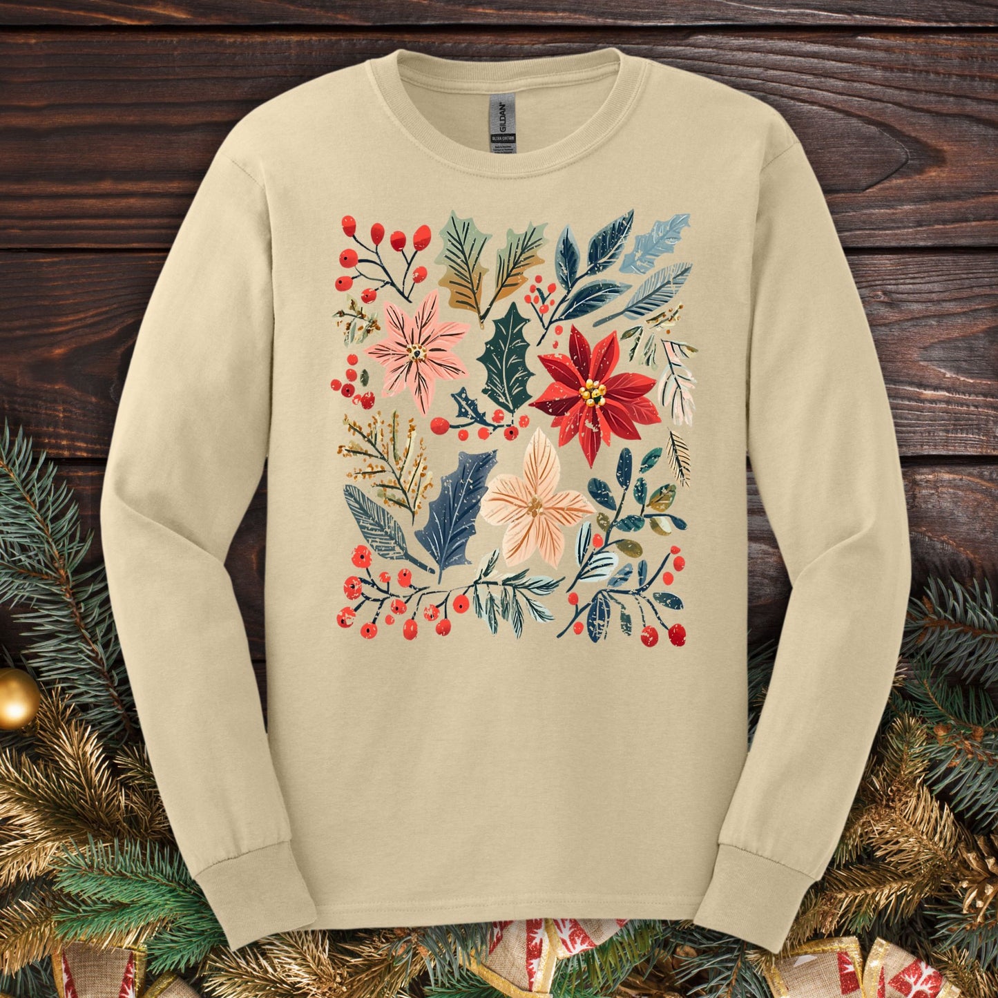 Sand long sleeve tee with a vibrant boho watercolor poinsettia and floral design, perfect for festive style.