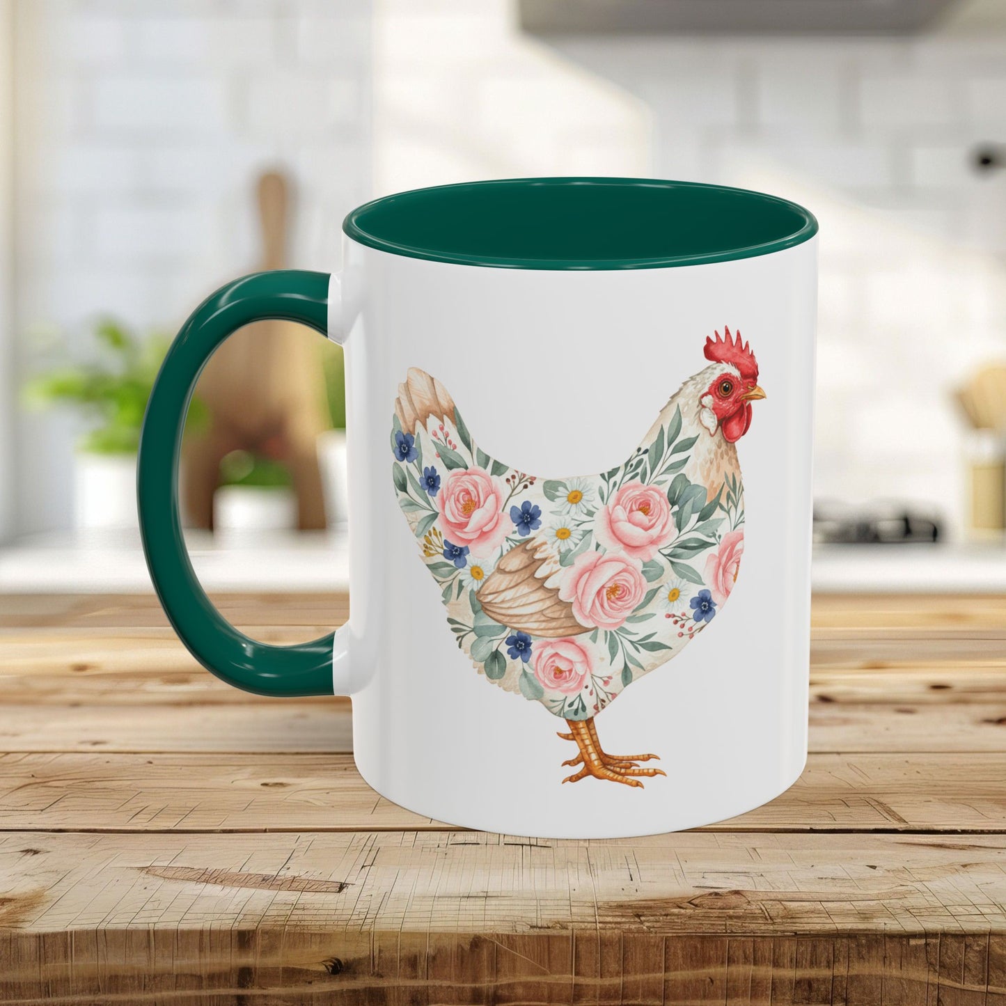 White ceramic mug with a watercolor floral chicken print, green interior, and C-handle on a wooden table.