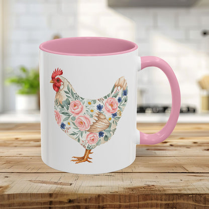 White 11oz ceramic mug with a pink interior and handle, featuring a watercolor floral chicken print.