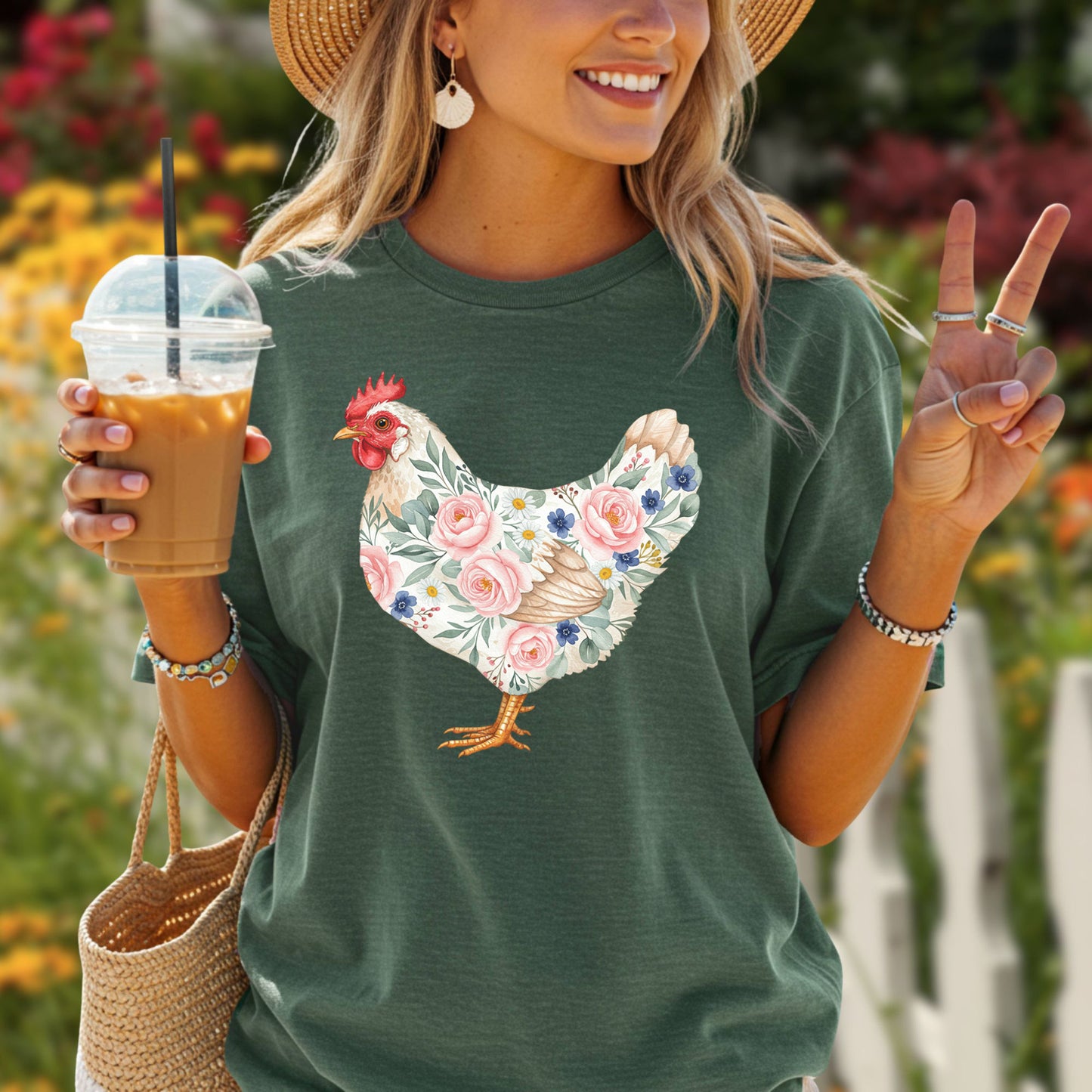 Woman in a relaxed-fit, garment-dyed forest green t-shirt with a botanical chicken design.