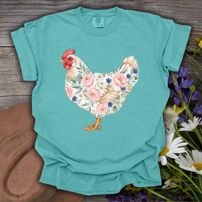Seafoam S t-shirt with a botanical chicken illustration featuring pink roses and blue flowers.