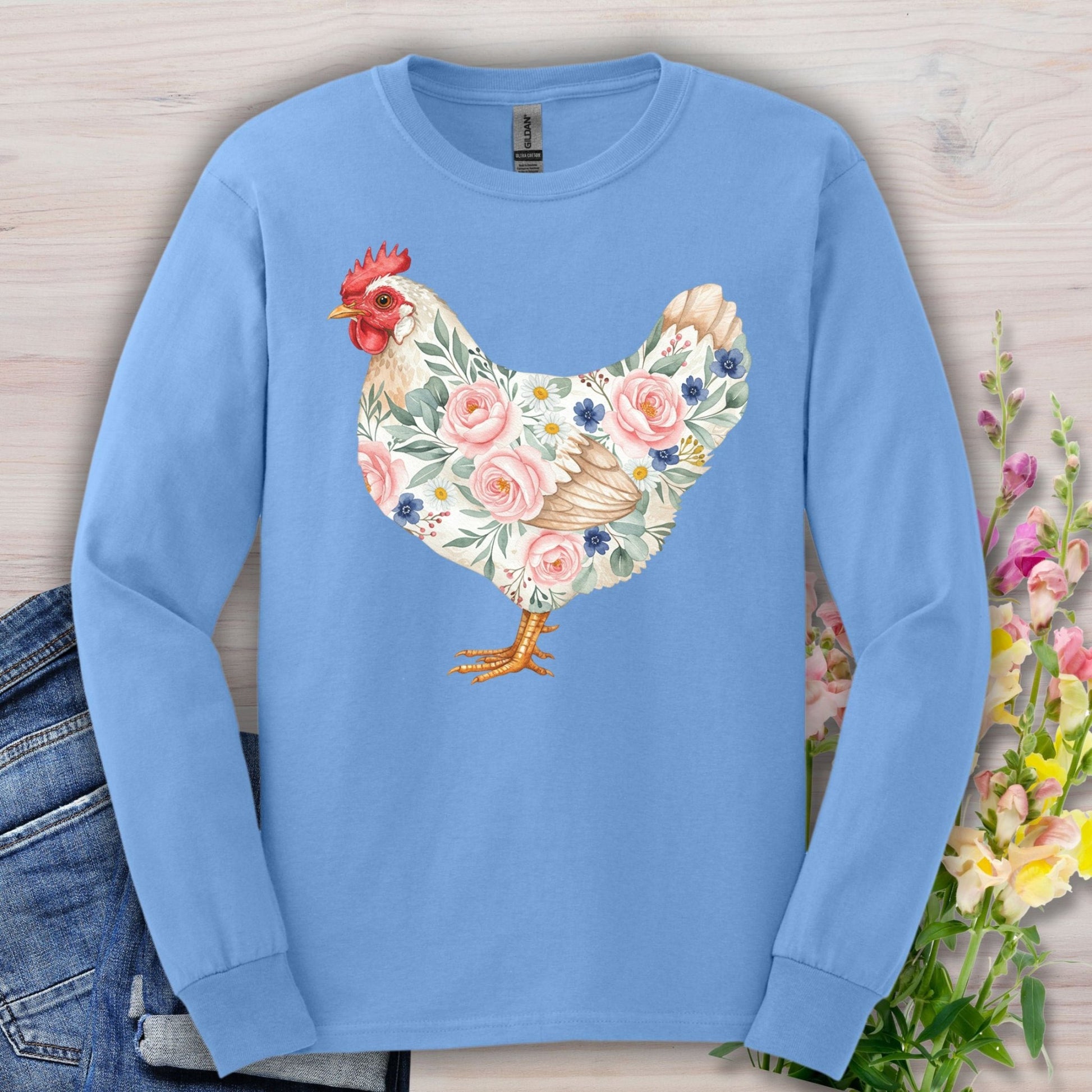 Carolina Blue long sleeve tee with a watercolor botanical hen design featuring pink and blue flowers.