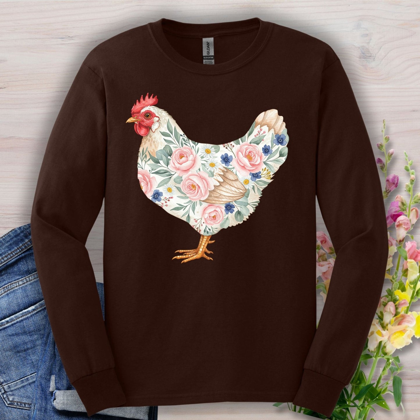 Dark Chocolate long sleeve tee with a watercolor hen design adorned with pink and blue botanical details.