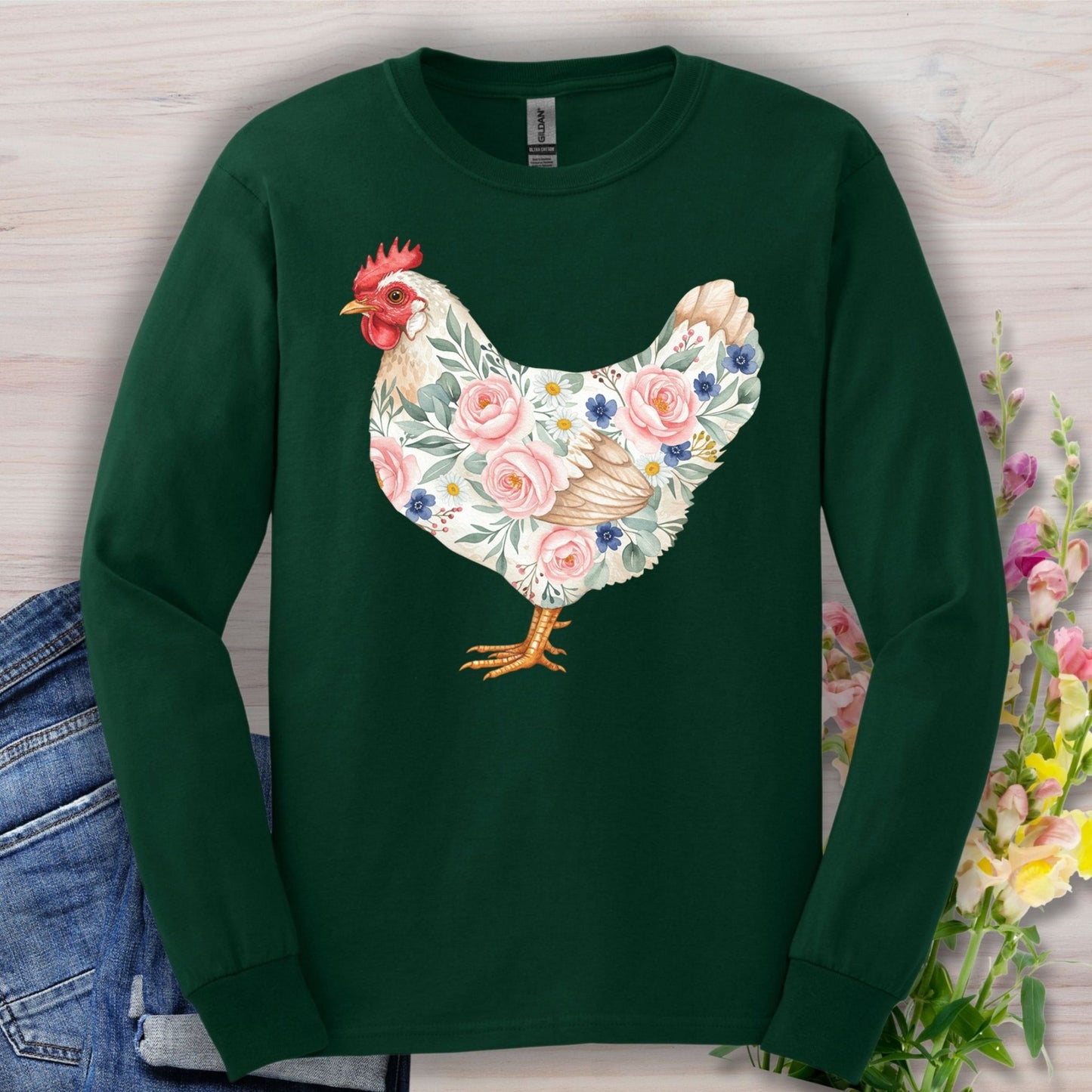 Forest Green long sleeve tee with a watercolor botanical hen design featuring pink and blue flowers.