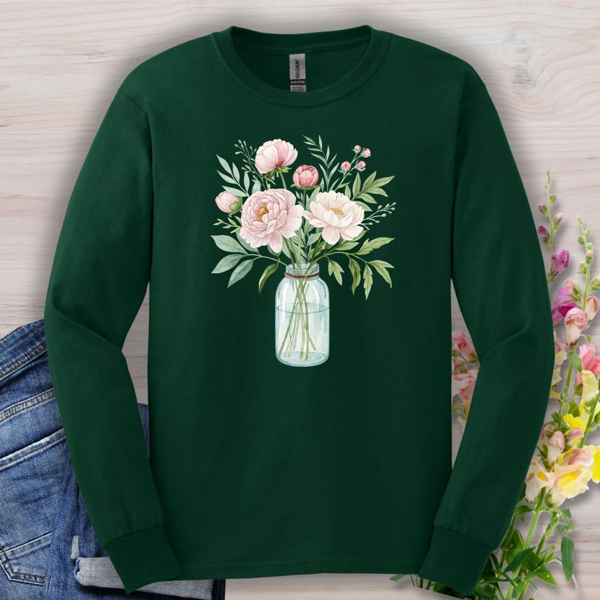 Forest Green long sleeve tee with a botanical peony arrangement in a glass jar, watercolor style.