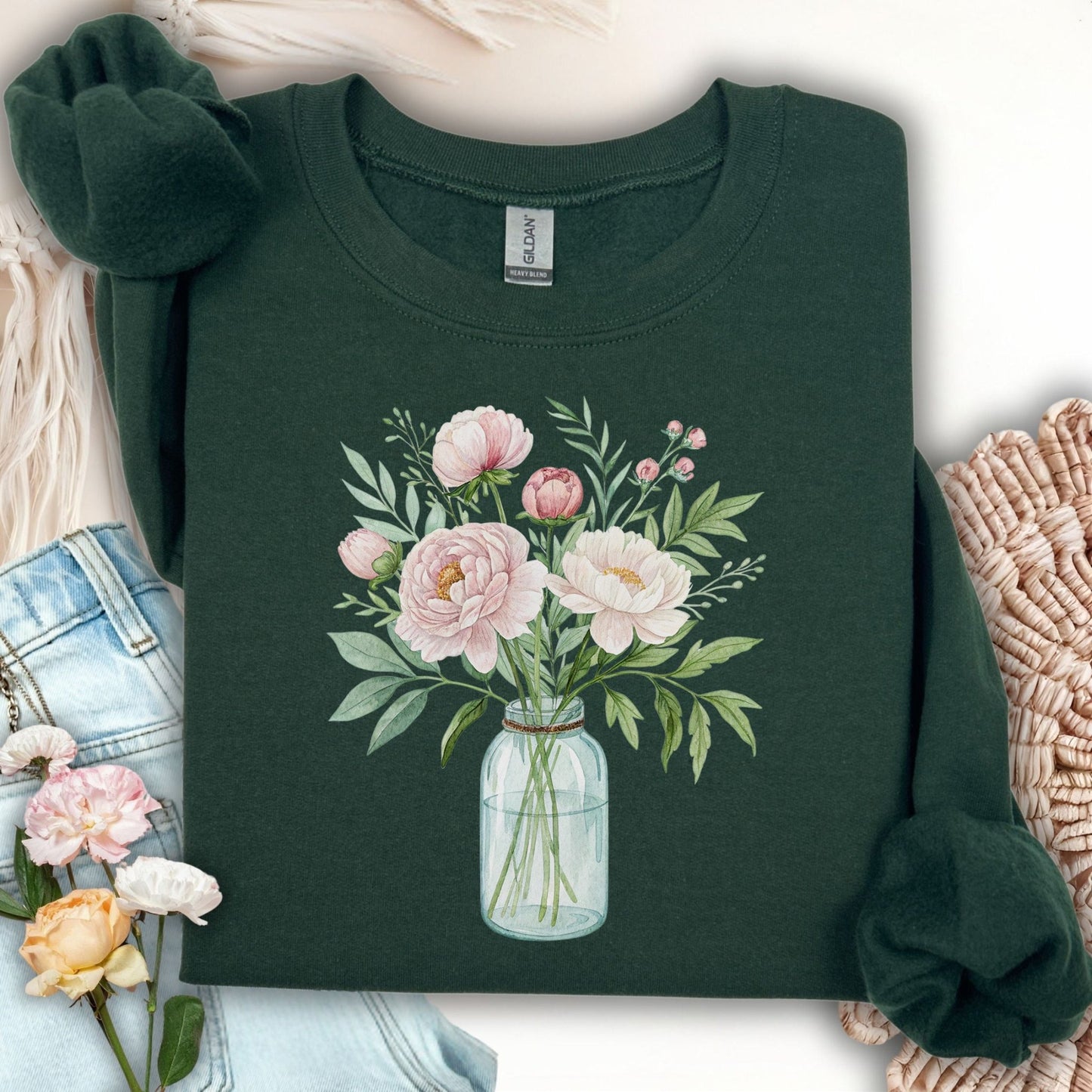 Forest Green sweatshirt with a botanical peony arrangement in a glass jar illustration.