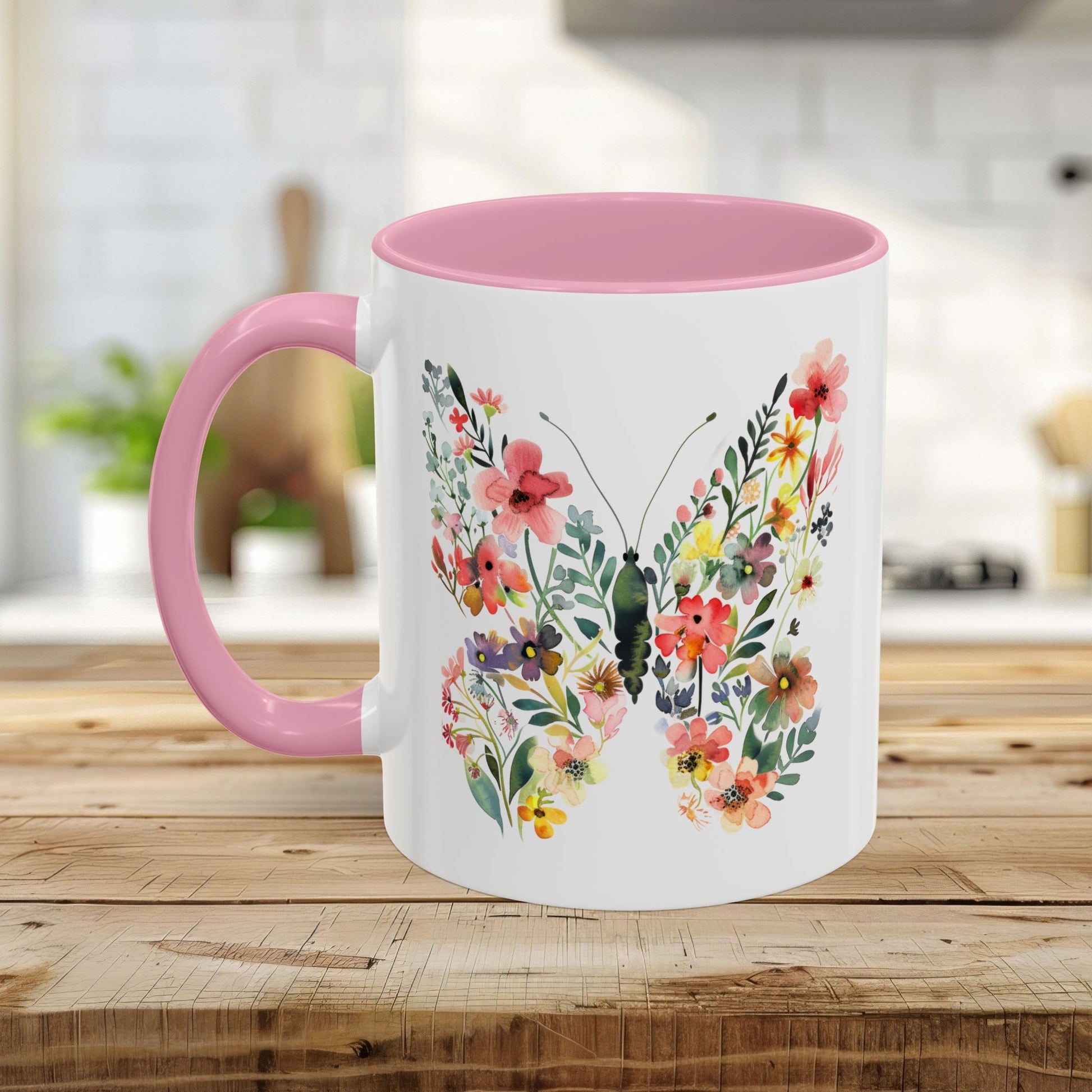 White ceramic mug with pink interior and handle, featuring a watercolor floral butterfly design.