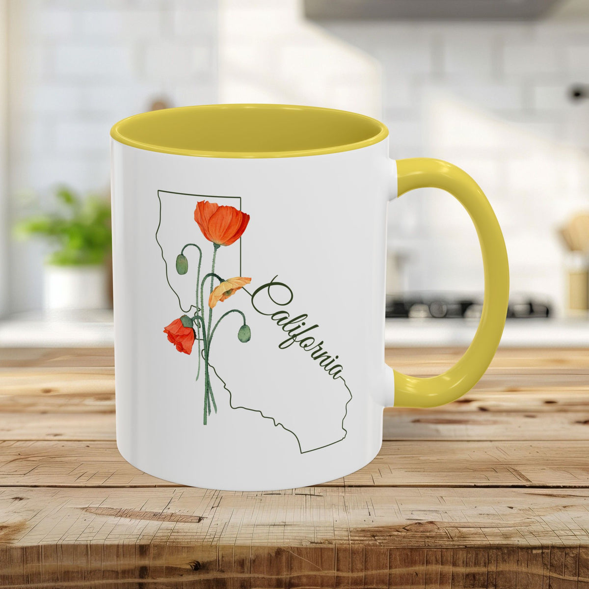 White 11oz ceramic mug with yellow handle and interior, featuring a California outline and hand-drawn poppies.