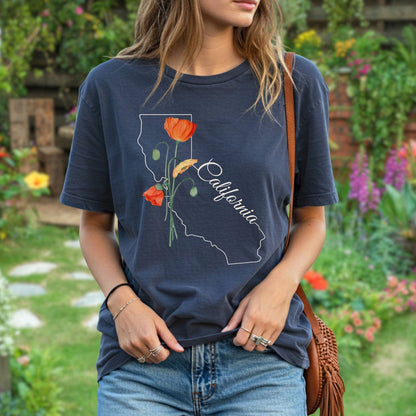 Garment-dyed navy cotton t-shirt with a white California outline and hand-drawn orange poppy design.