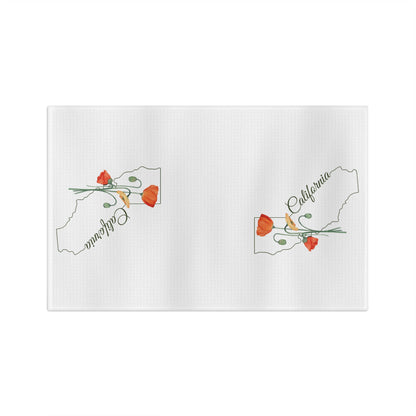 White microfiber tea towel with two California outlines and hand-drawn orange poppies.