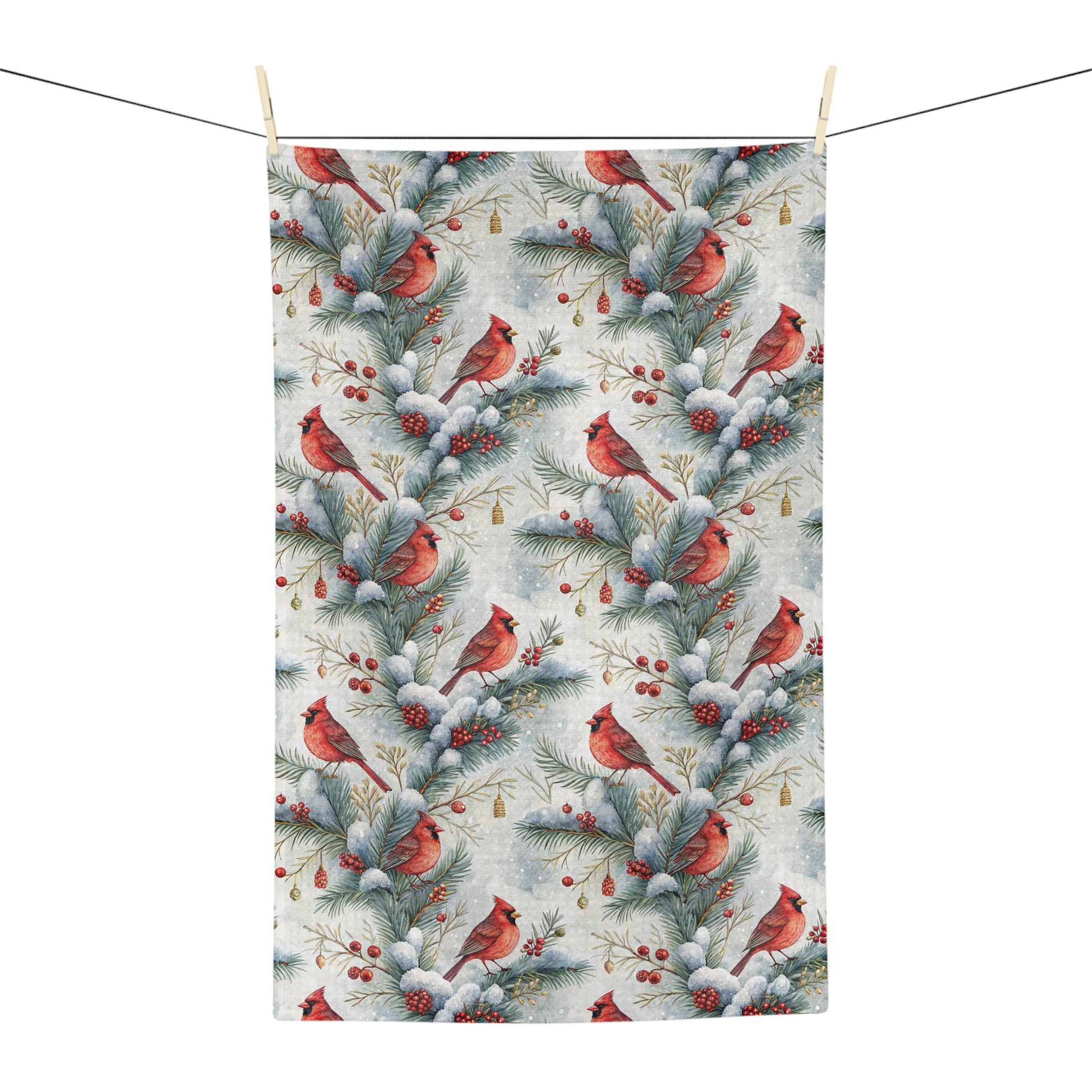 Microfiber tea towel with a repeating watercolor pattern of red cardinals on snowy pine branches and holly berries.