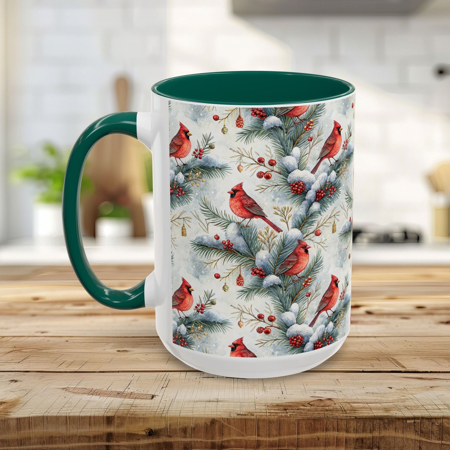 White ceramic mug with green interior and handle, featuring a watercolor cardinal on snowy evergreens.