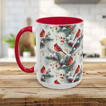 White ceramic mug with red interior and handle, featuring a watercolor cardinal and snowy evergreen design.
