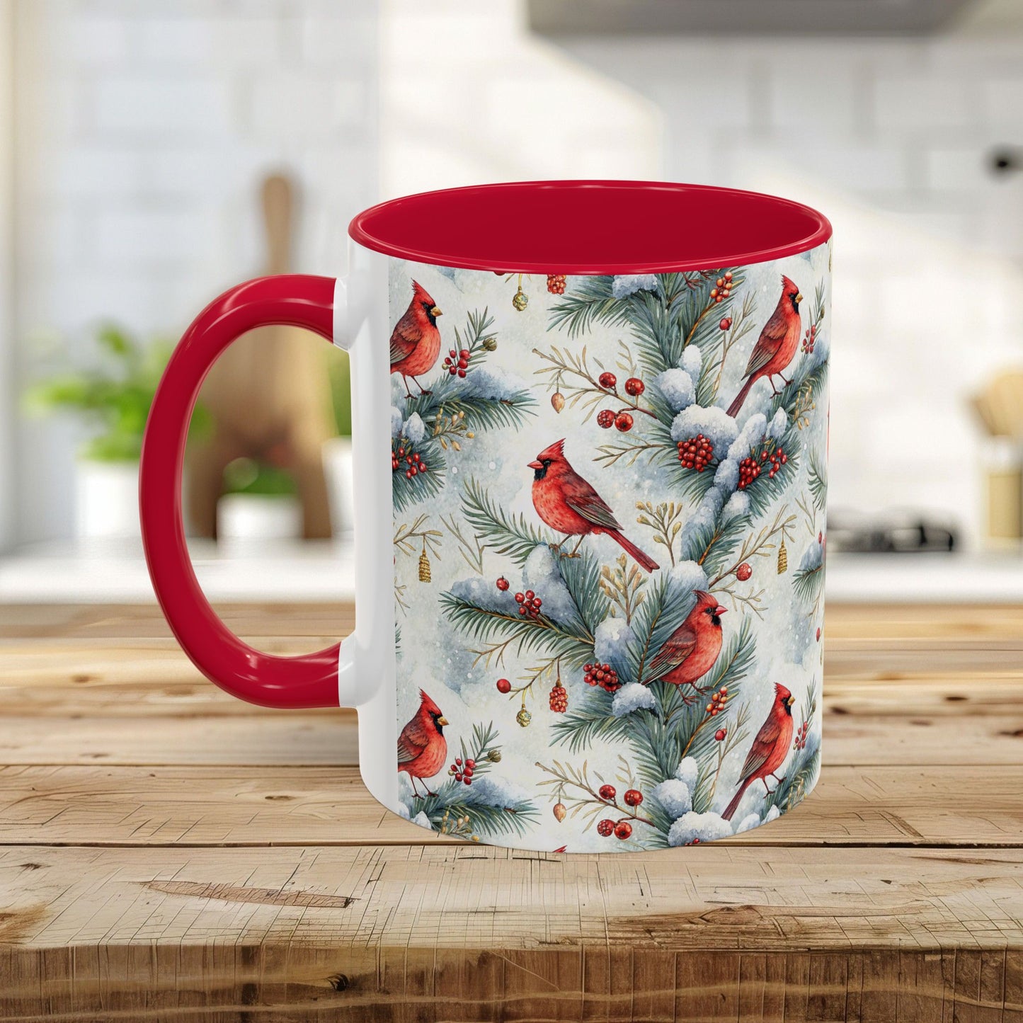 White ceramic mug with red interior and handle, featuring a watercolor cardinal and snowy evergreen design.