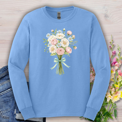 Carolina Blue long-sleeve tee with a cheerful botanical bouquet of pink and white flowers tied with a ribbon.