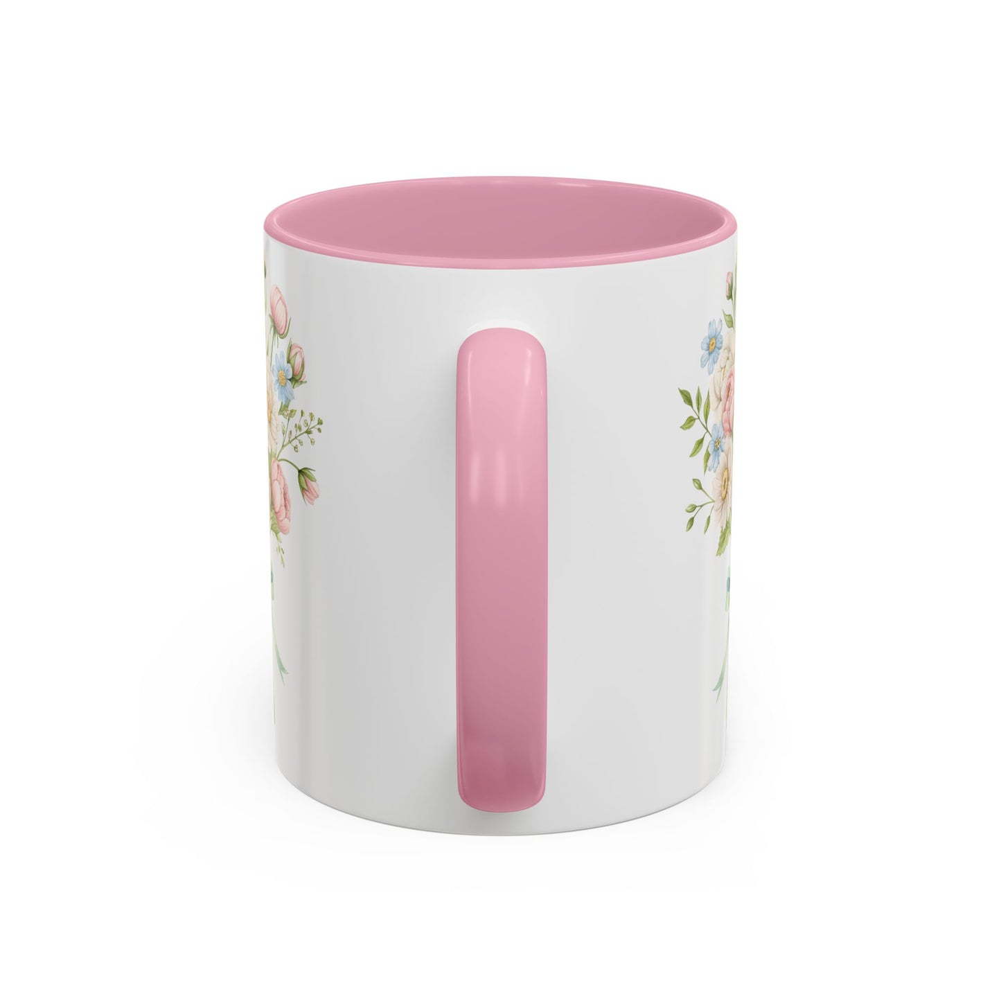 White ceramic mug with pastel floral bouquet print, pink interior, and C-shaped handle.