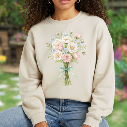 Cheerful Easter Bouquet Sweatshirt: Beige crewneck with a tied floral illustration of pink peonies, white daisies, and blue flowers.