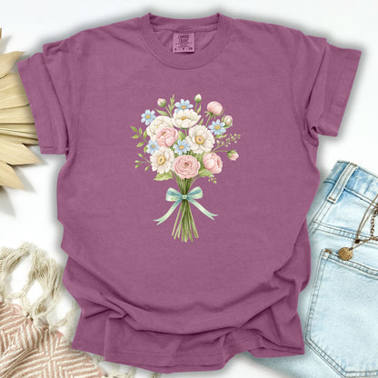Berry S-sized garment-dyed cotton t-shirt with a watercolor floral bouquet and mint ribbon.