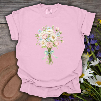 Blossom pink garment-dyed cotton t-shirt with a watercolor floral bouquet and mint ribbon.