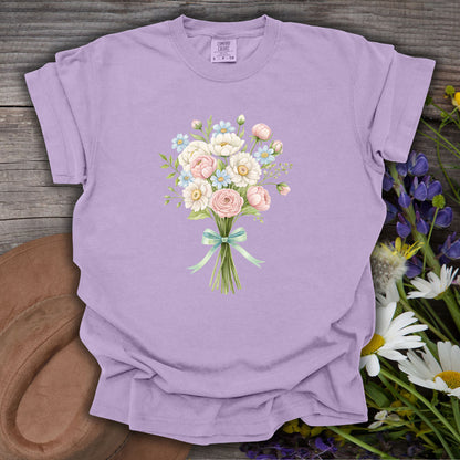Orchid S-size garment-dyed cotton tee with a watercolor floral bouquet and mint ribbon.