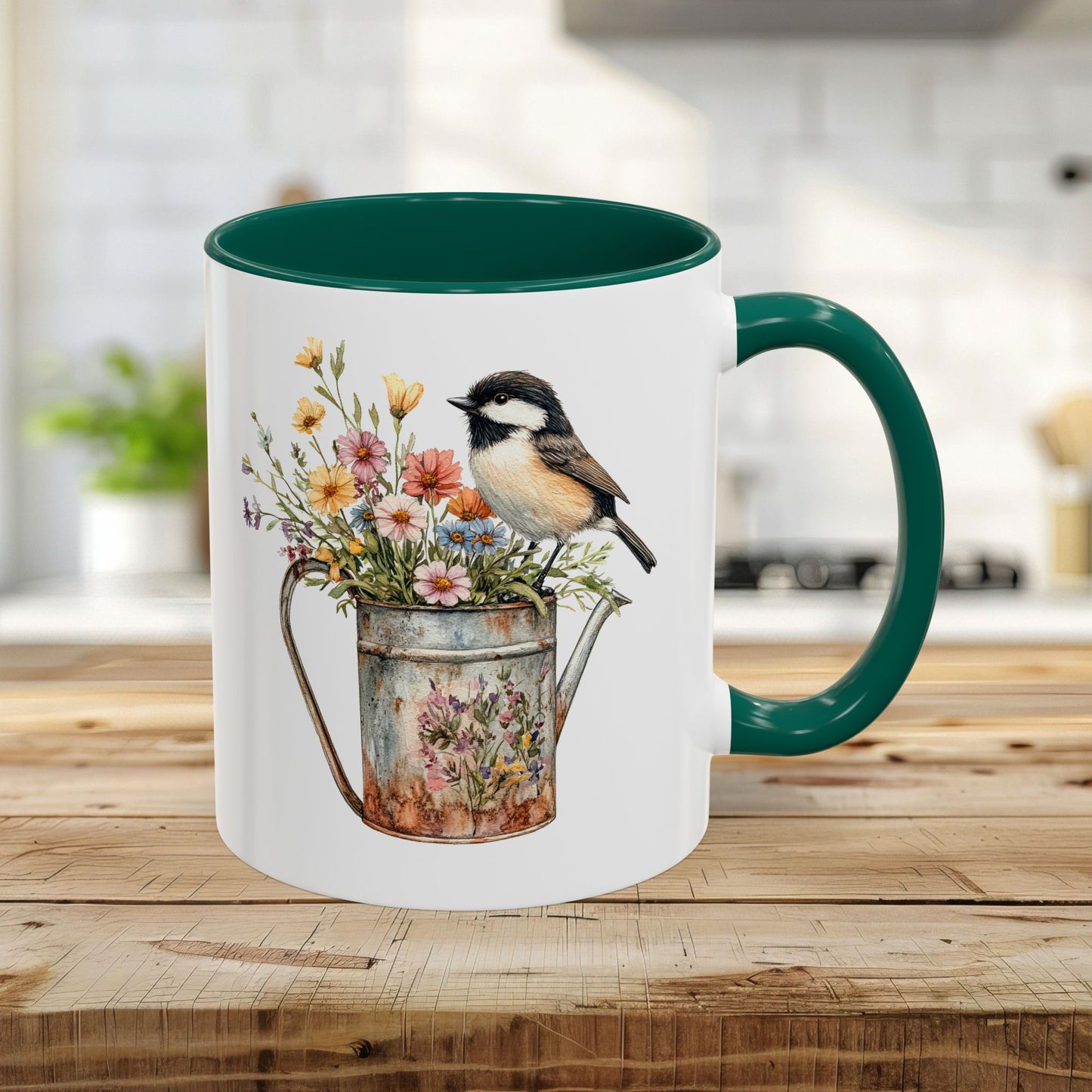 White ceramic 11oz mug with green handle and interior, featuring a watercolor chickadee on a floral watering can.